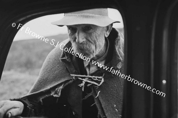 OLD MAN AT CAR WINDOW
